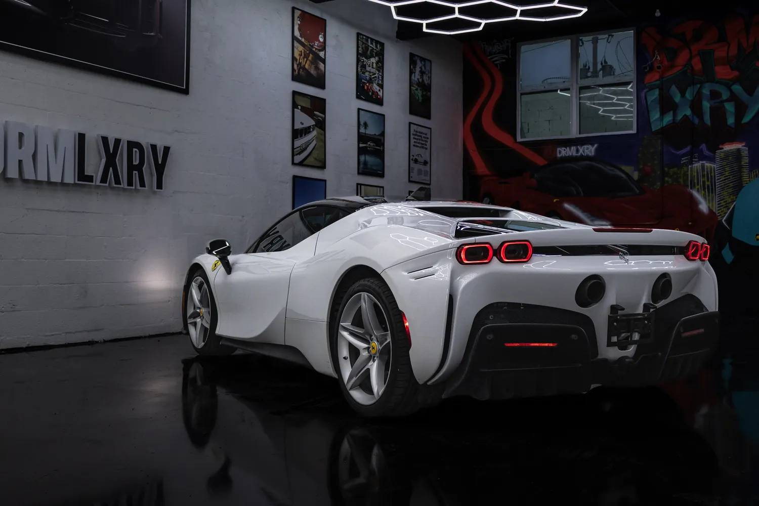 White Ferrari SF90 Stradale, rear three-quarter view
