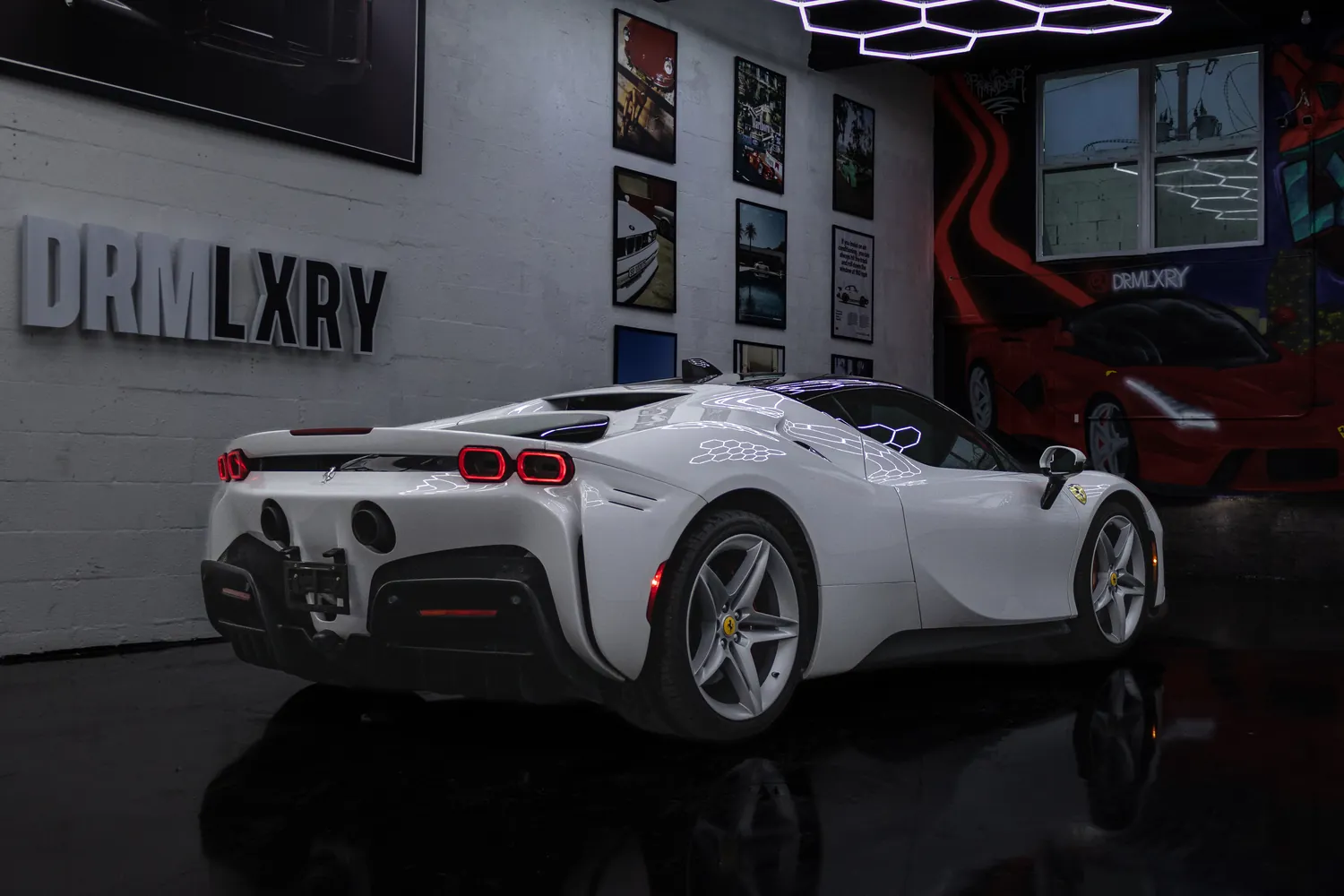 White Ferrari SF90 Stradale, rear three-quarter view from the left