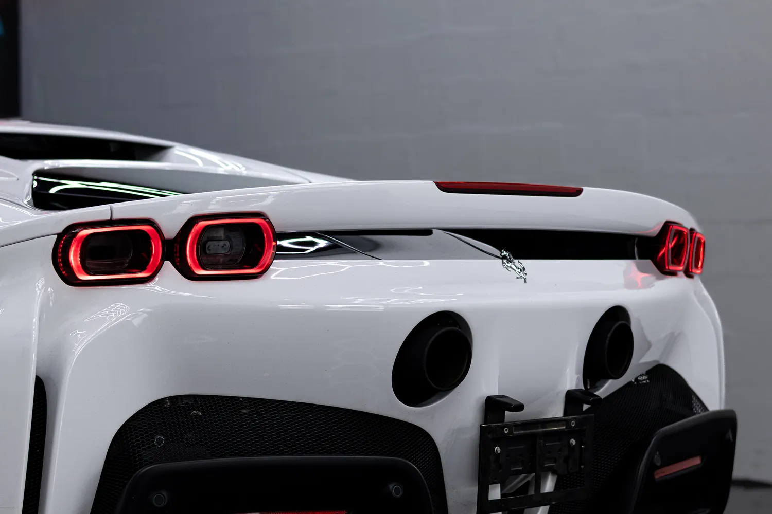 Close-up of the Ferrari SF90 Stradale taillights and rear deck