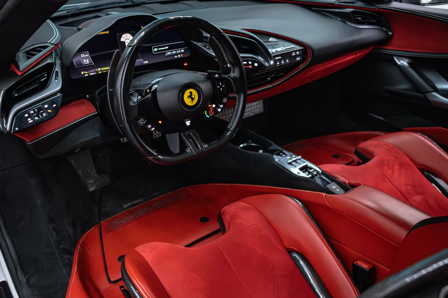Ferrari SF90 Stradale cockpit with red seats and digital instrument display