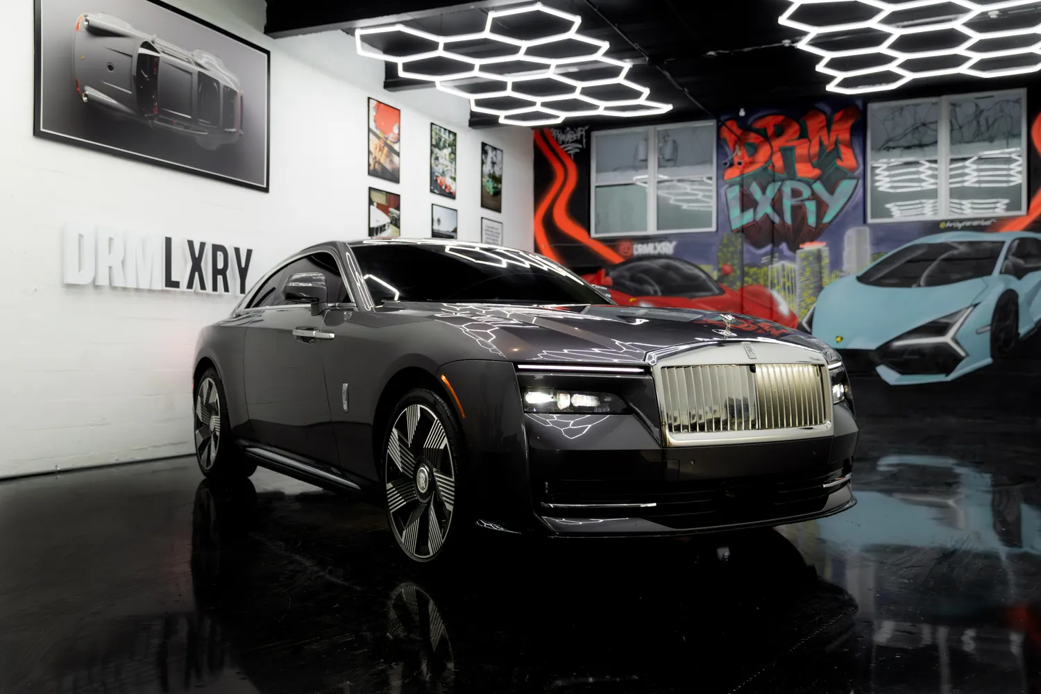 Grey Rolls-Royce Spectre, front three-quarter view from the right