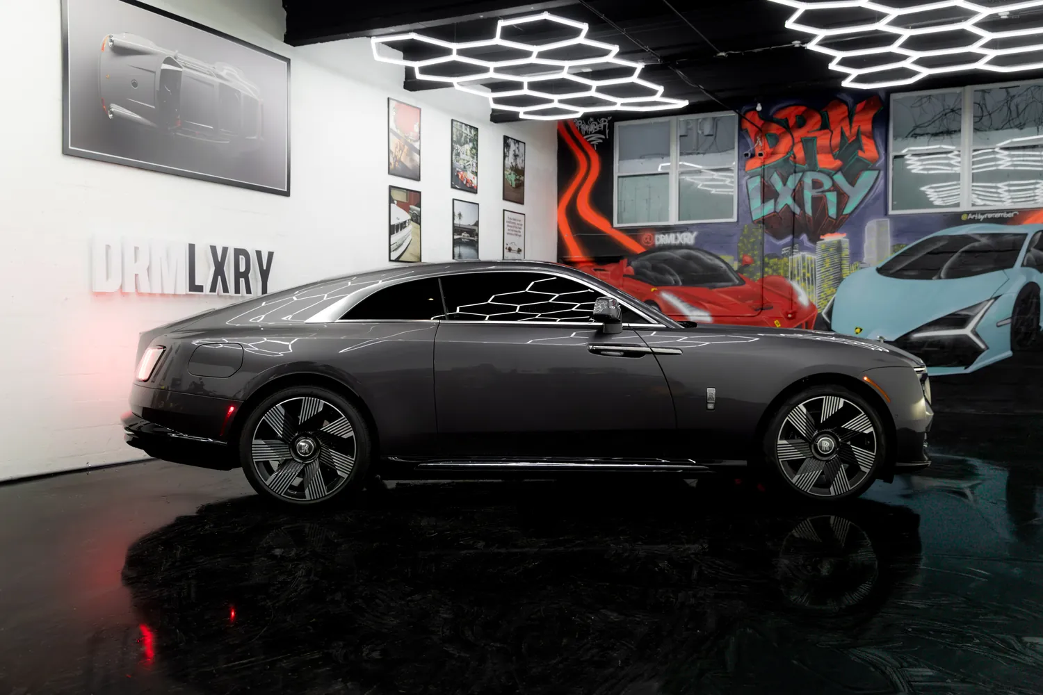 Side profile of the grey Rolls-Royce Spectre coupe