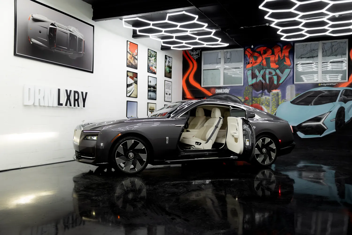 Rolls-Royce Spectre with its long coach doors open, showing the white interior