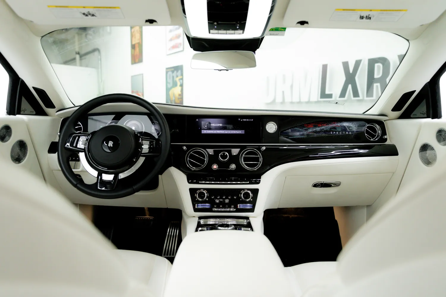 Rolls-Royce Spectre dashboard with white leather and digital displays
