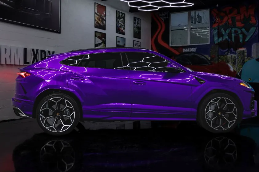 Side profile of the purple Lamborghini Urus