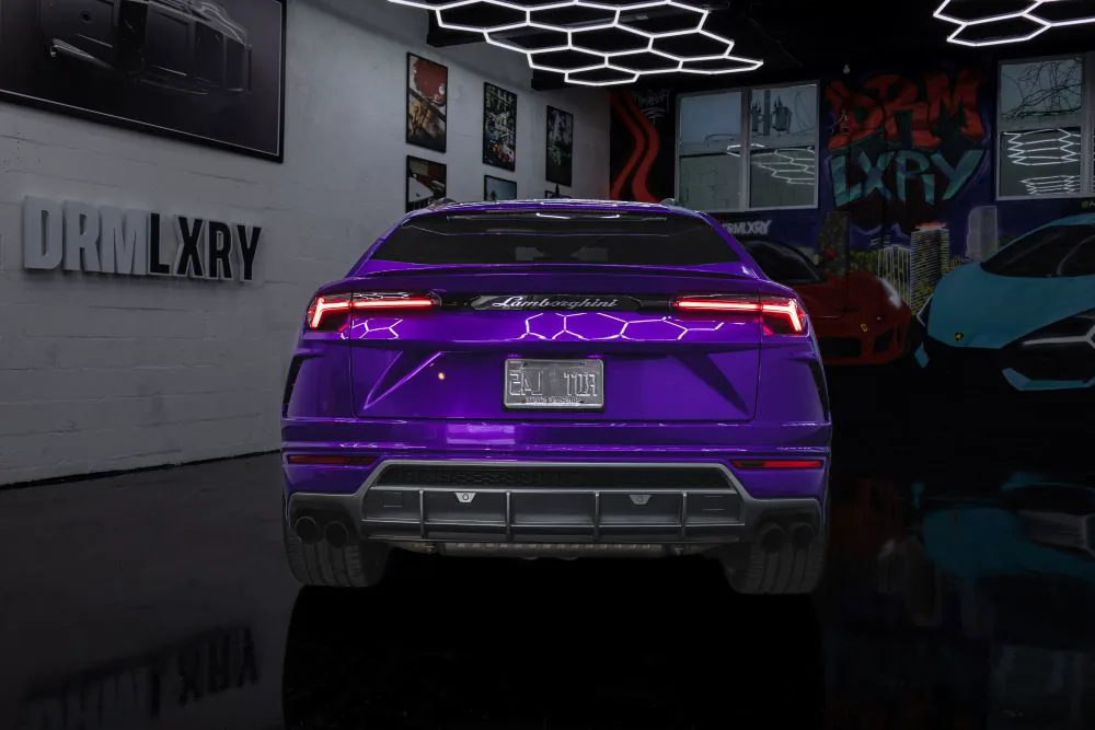 Rear view of the purple Lamborghini Urus with full-width taillight